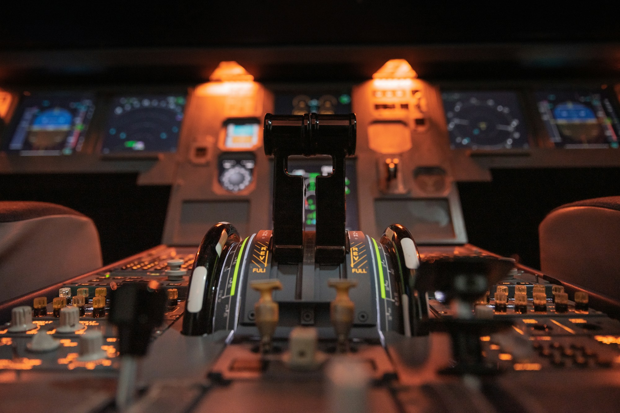 Cockpit throttle levers in warm instrument light